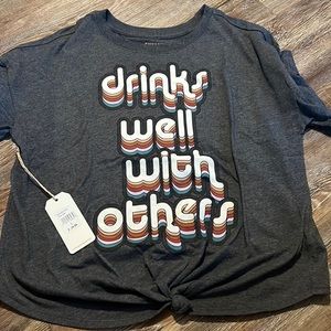 New tee with tags-runs small fits like a medium